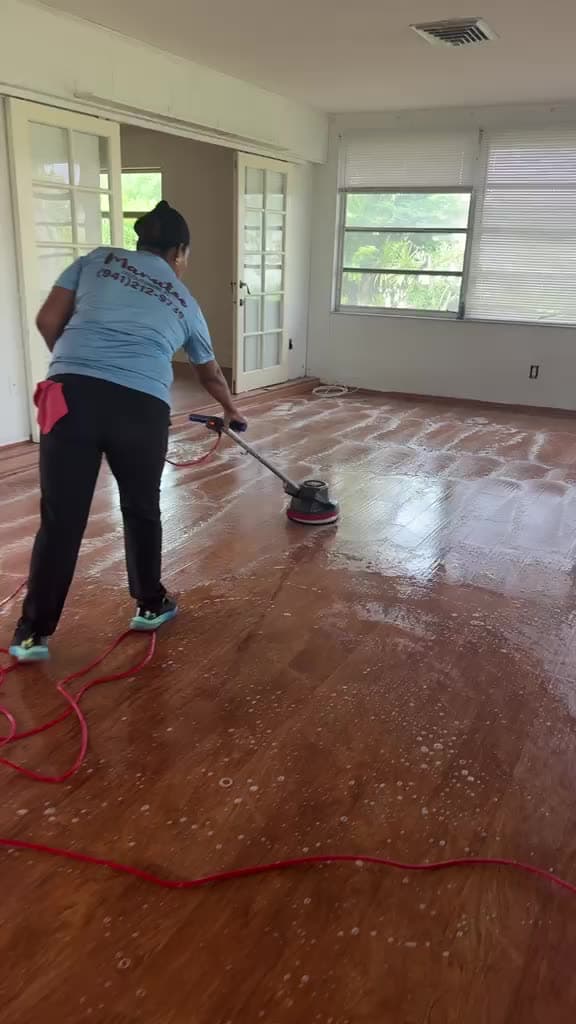 Manatee Ladies crew member machine-scrubbing a floor in Bradenton FL