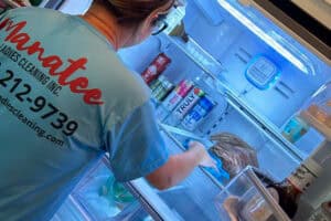 Manatee Ladies Cleaning team member deep cleaning a kitchen in Bradenton, FL